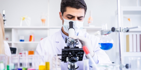 Scientist analysing samples in a lab